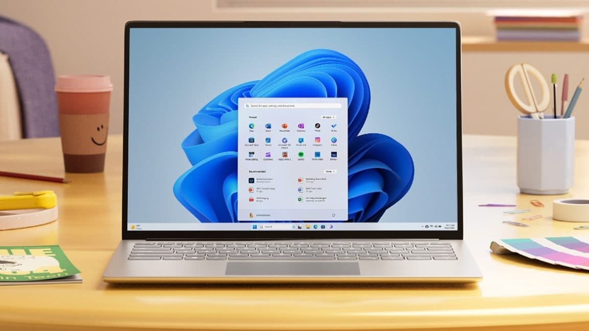 Windows 11 desktop with taskbar and Copilot panel open on a laptop screen