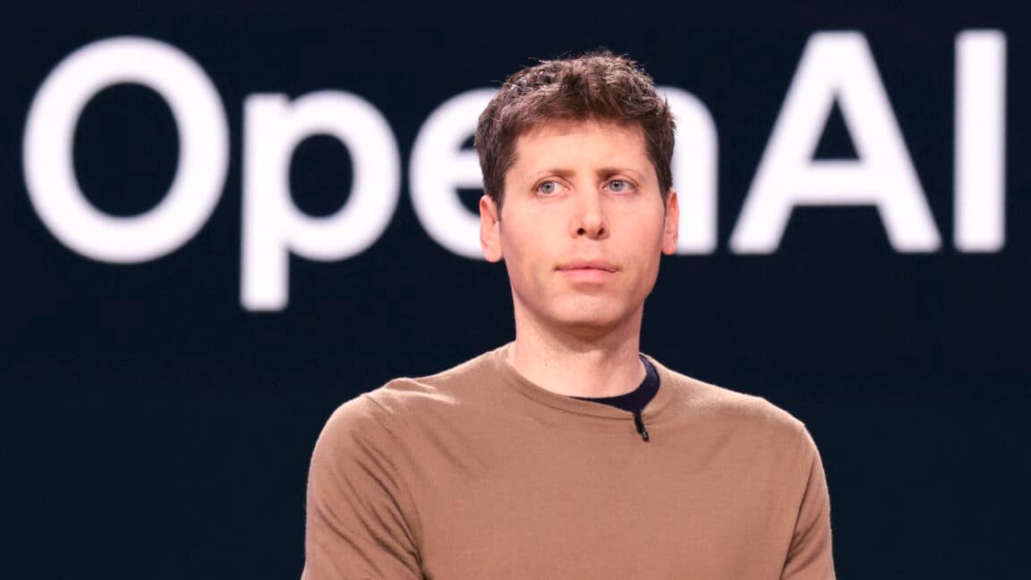 Sam Altman speaking on stage at a technology conference about AI