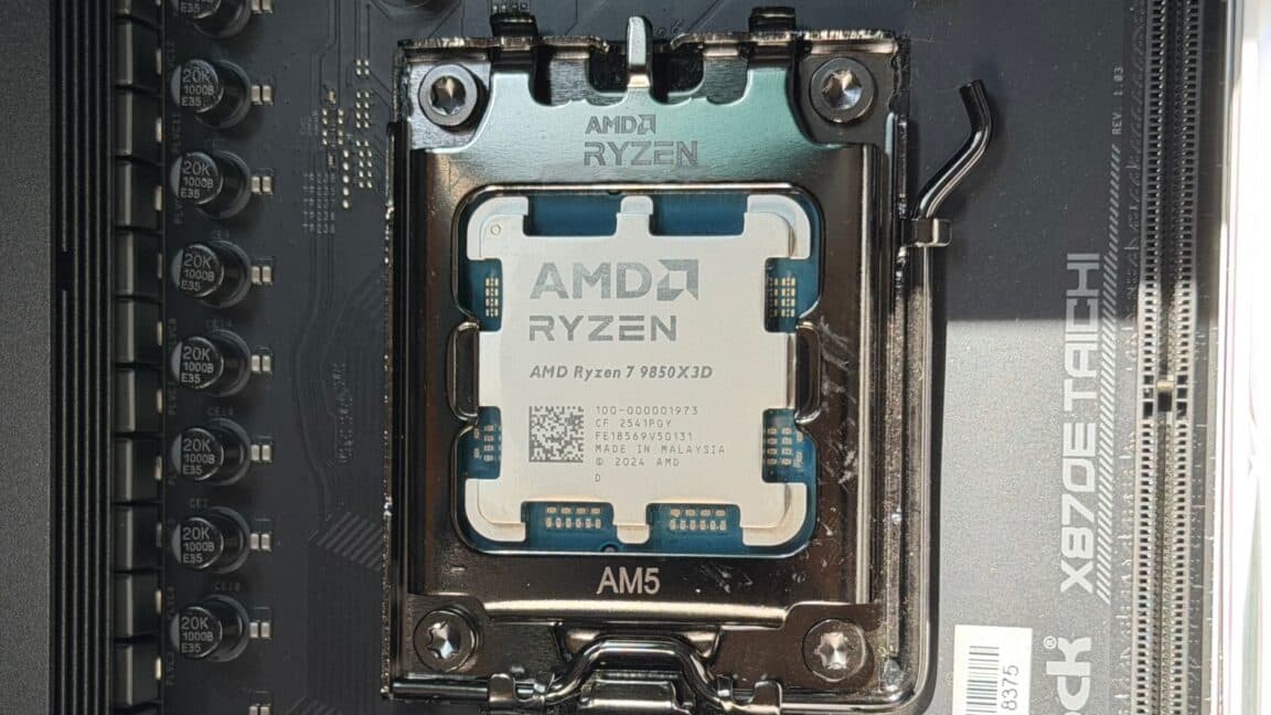 Close-up of an AMD Ryzen 7 9850X3D desktop processor installed on a gaming motherboard