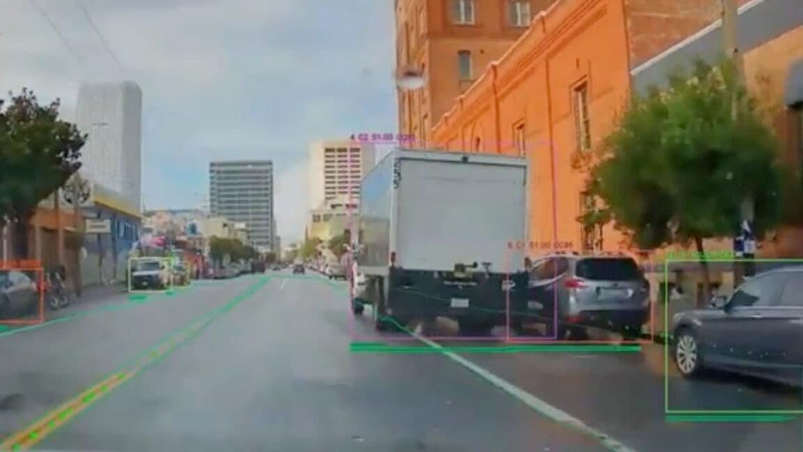 AI camera mounted on a city vehicle monitoring a bike lane in traffic
