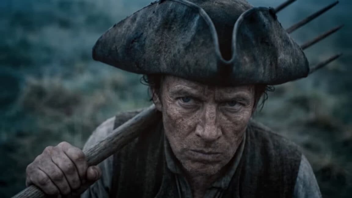 AI-generated 18th century figures on a monitor in a dark film editing studio