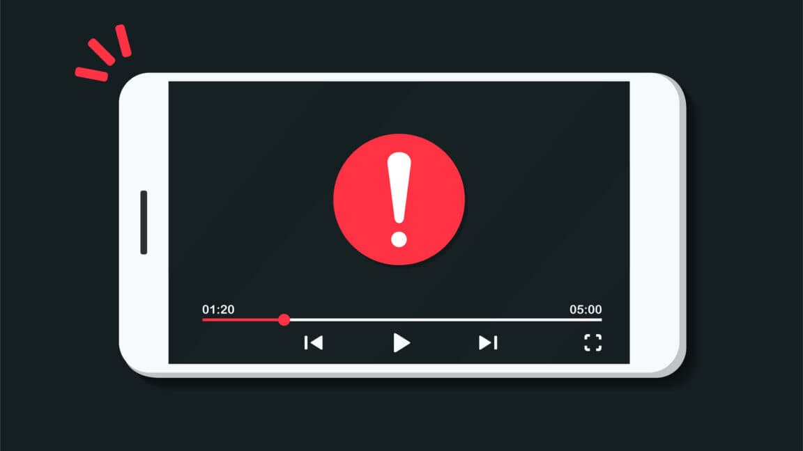 Close-up of a laptop streaming 4K video with codec icons overlaid