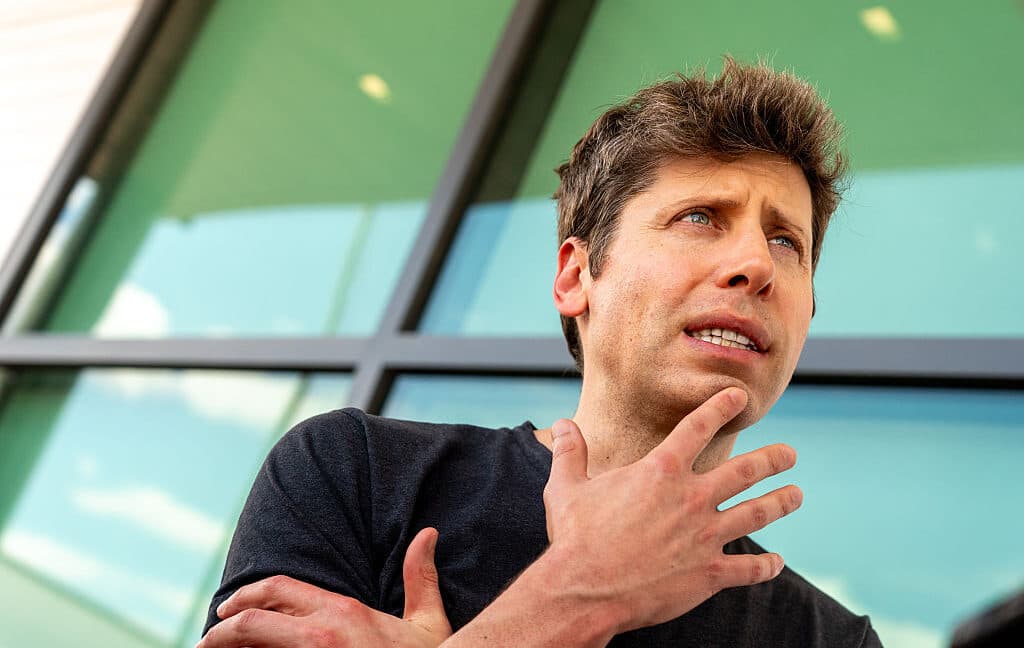 Illustration of a chatbot on a laptop with an adult content warning and a worried user beside it.