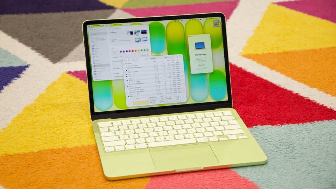 Technician replacing the keyboard on a slim Apple MacBook Neo laptop