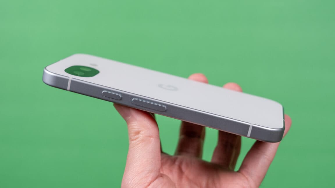 Google Pixel 10a smartphone lying flat with its rear camera module flush to the back panel