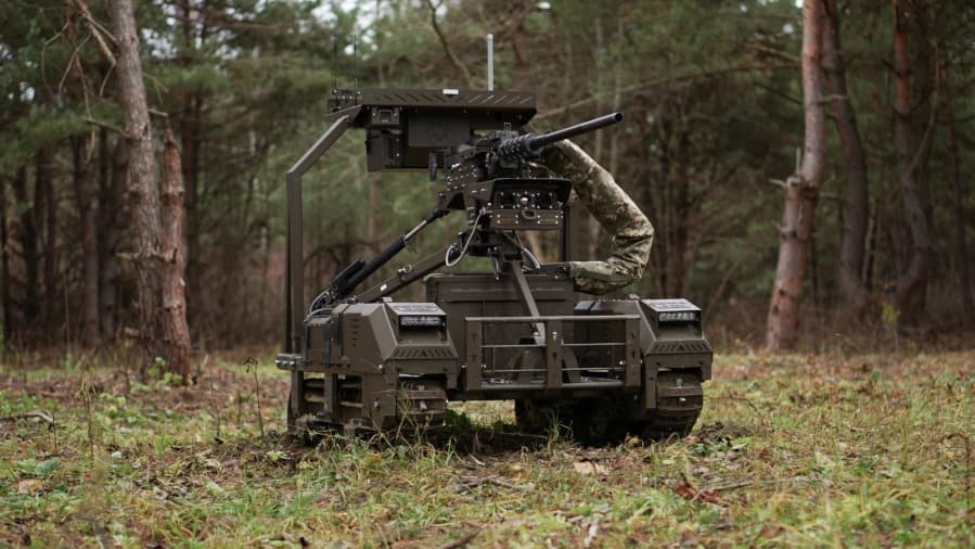 Remote-controlled Ukrainian ground combat robot moving across a battlefield