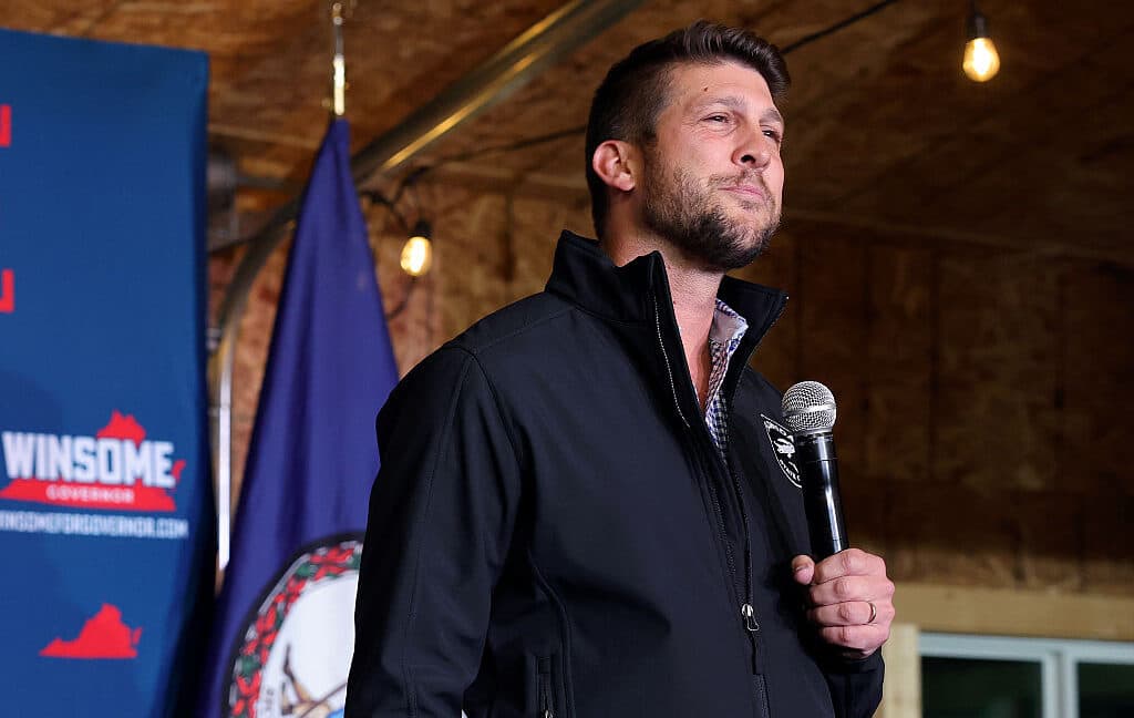 Laptop screen showing an AI chatbot interface overlaid with police tape