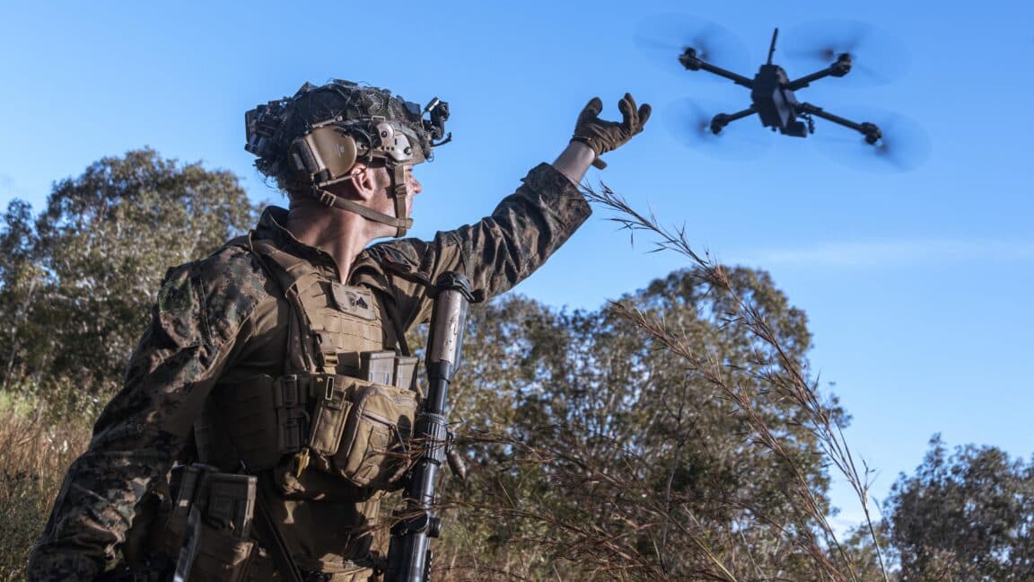 US Marine launching a small military drone during a field exercise