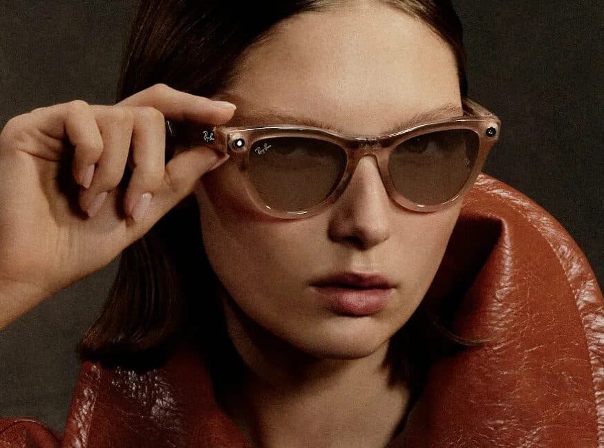 Person wearing Ray-Ban Meta smart glasses in a busy city street