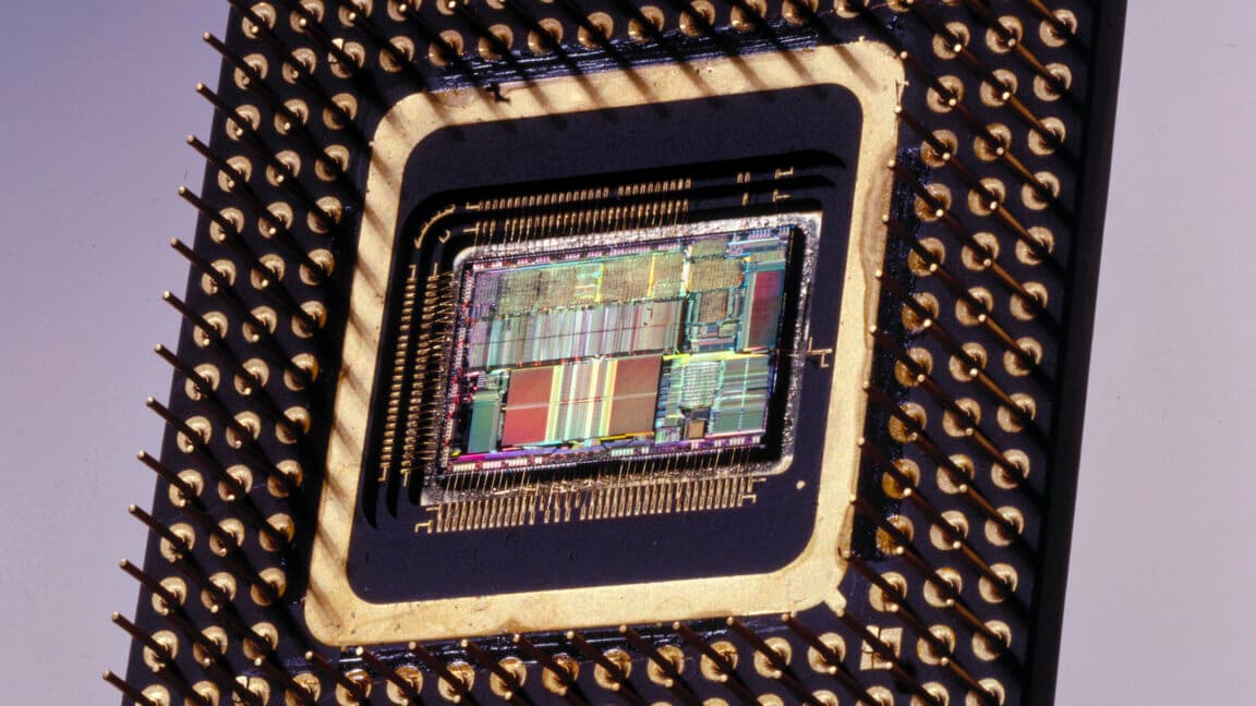 Close-up of an old Intel 486 processor chip on a vintage PC motherboard