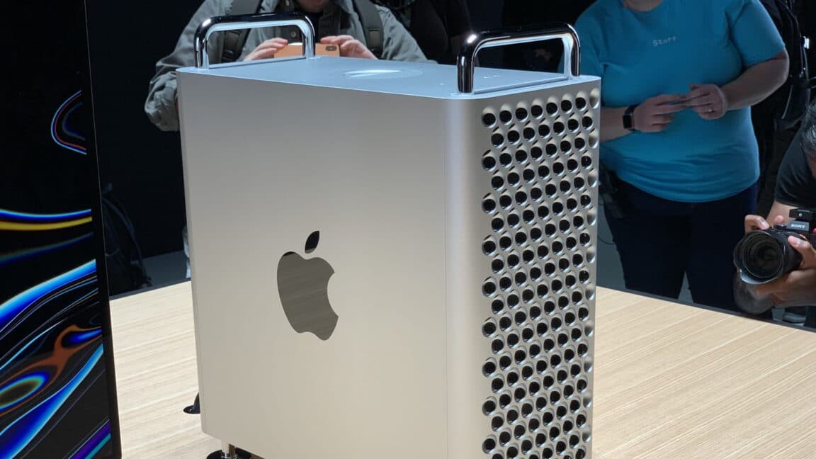 Apple Mac Pro tower workstation on a studio desk with monitor and accessories